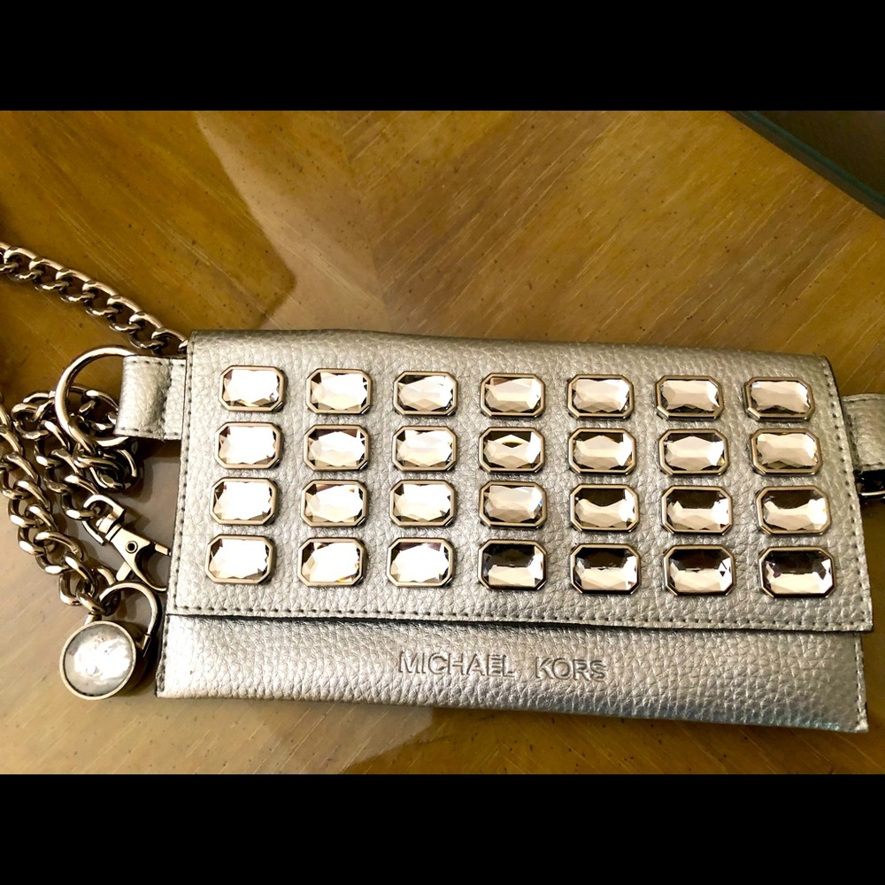 Silver waist Fanny pack with silver chain.